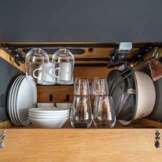 Tableware set as insert in wall cabinet